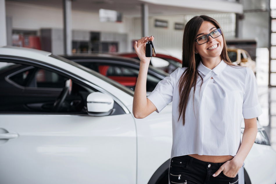 girl holding car keys