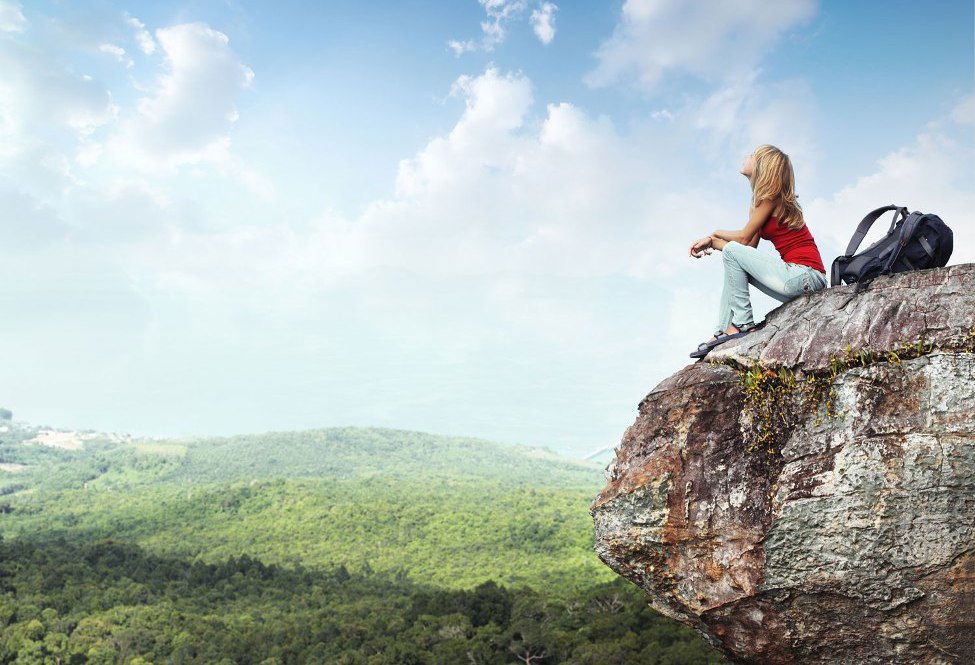 woman sitting on a rock