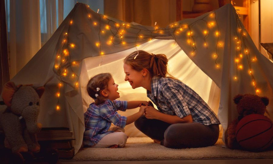 mother and daughter in tent