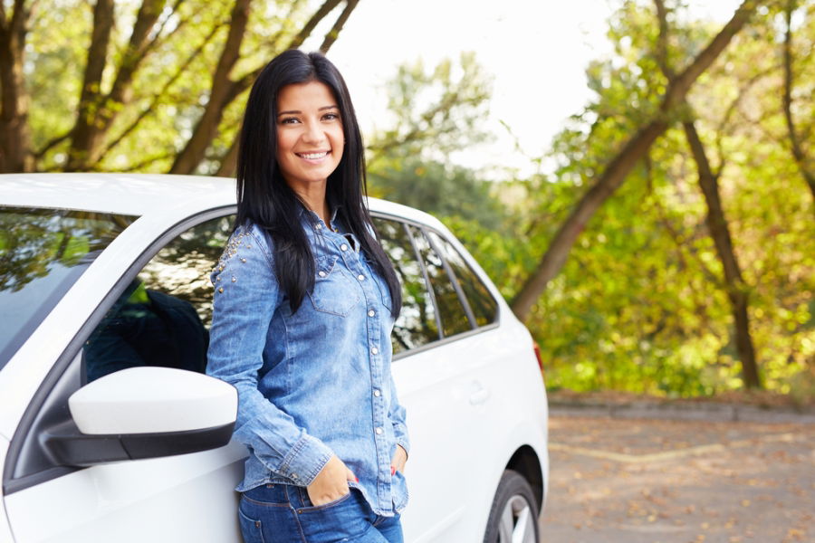 woman leaning on car