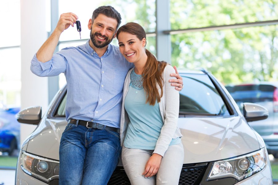 couple buying a new car