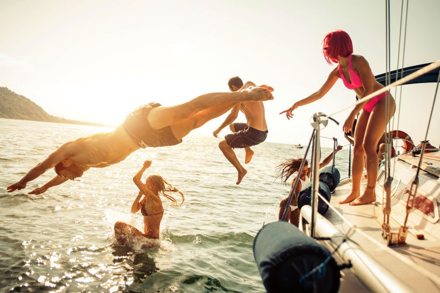 people jumping off a boat