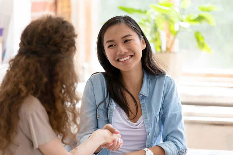 Asian woman getting help