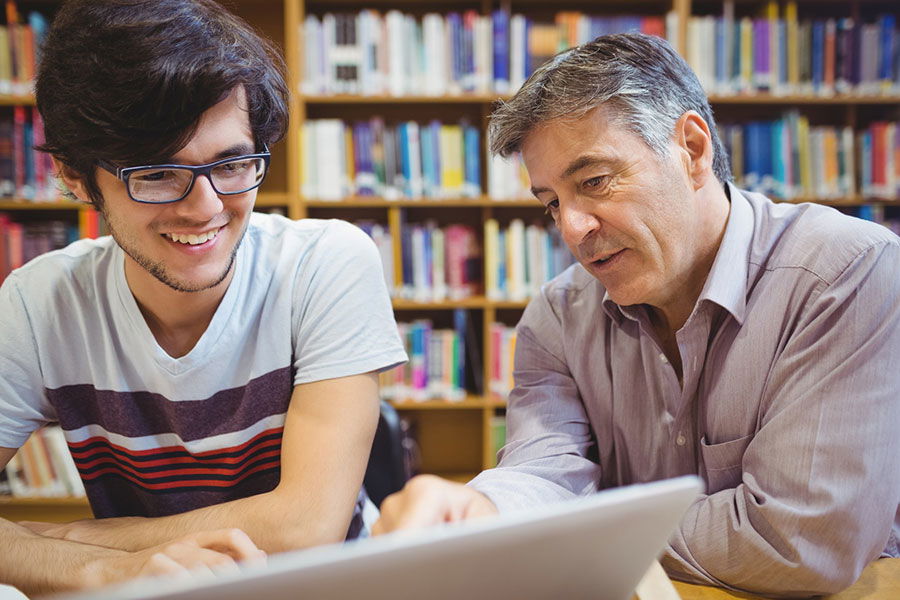 teacher helping student