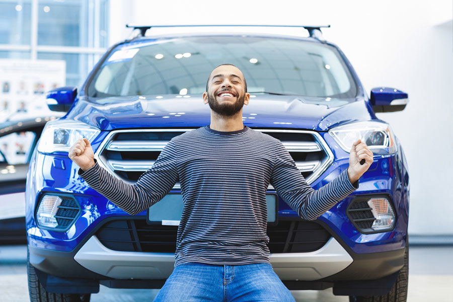 man in front of car