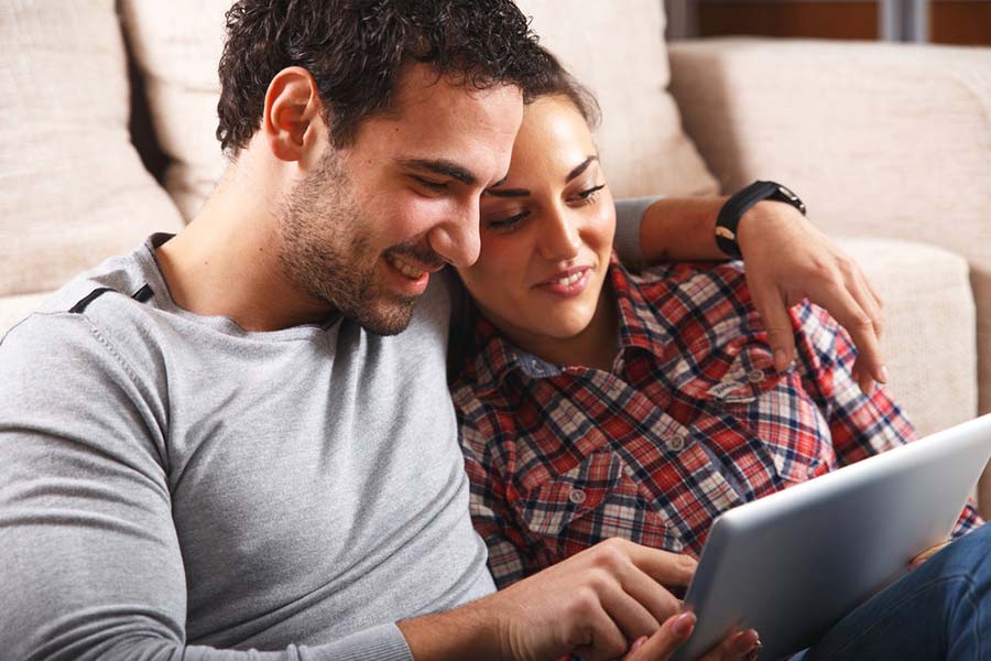 young couple on tablet