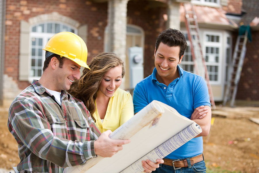 couple looking at home plans