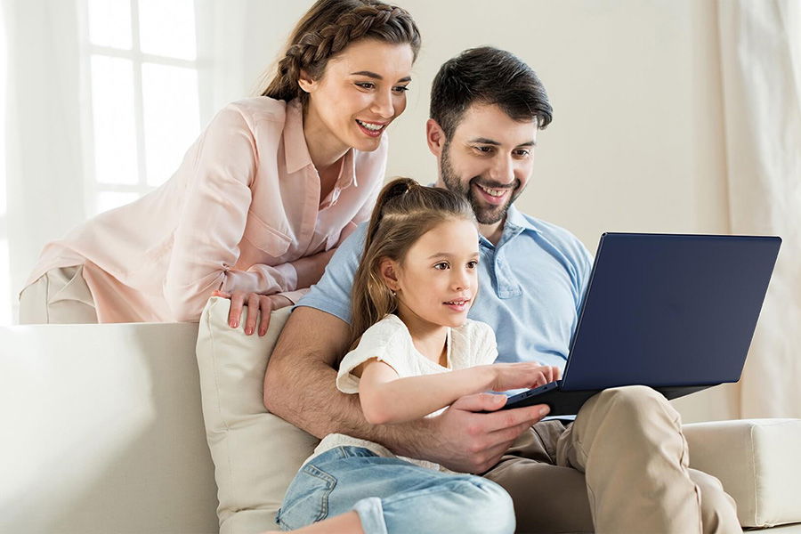 family viewing laptop