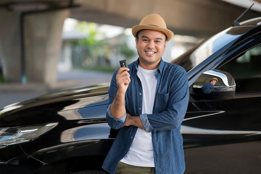 man with new car