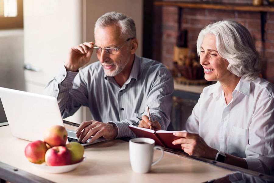 senior couple on laptop