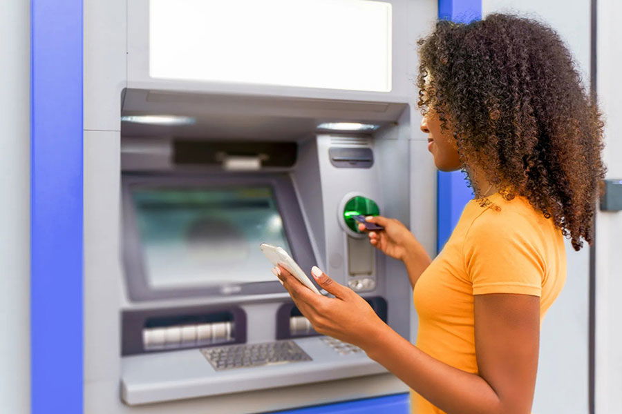 woman using ATM