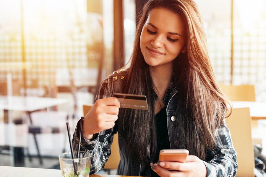 woman using debit card