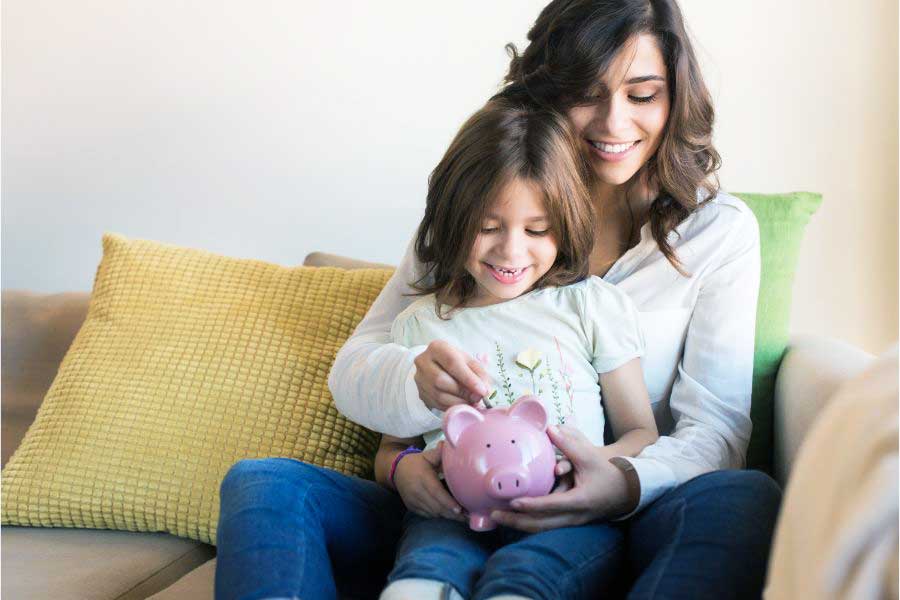 mother and daughter saving money