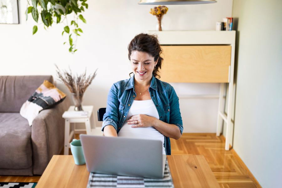 pregnant woman working on finances