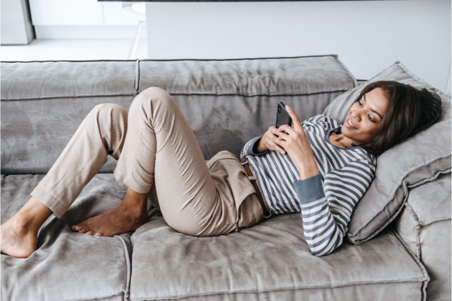 woman laying on couch