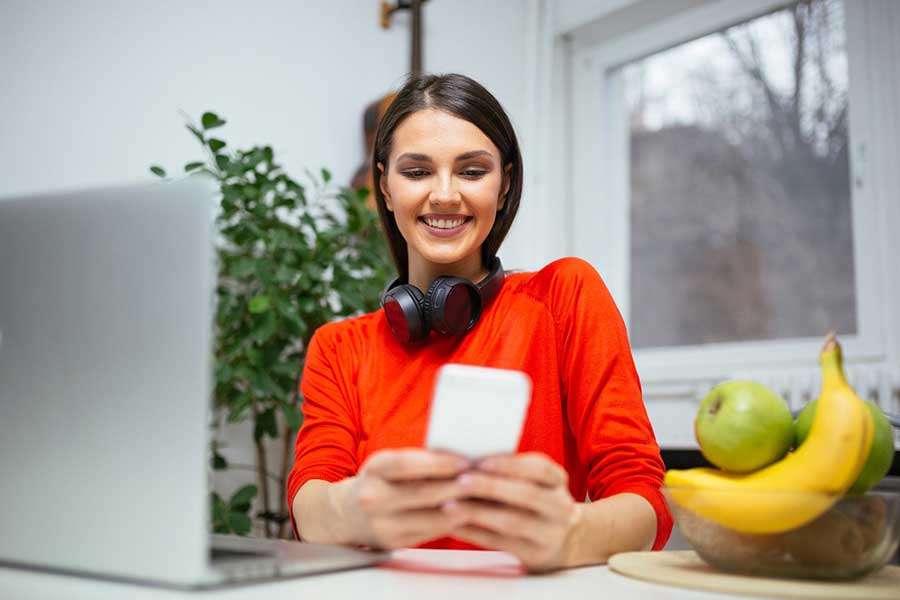 woman checking credit score on phone