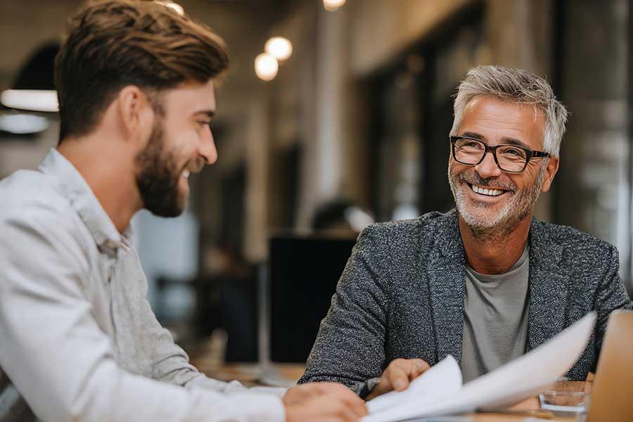 male investors discussing portfolio
