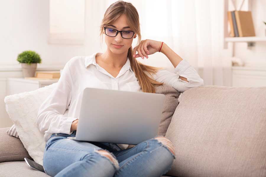 woman reviewing credit report online
