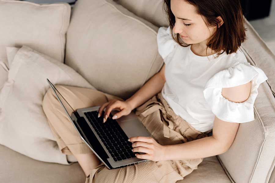 woman on laptop checking credit score