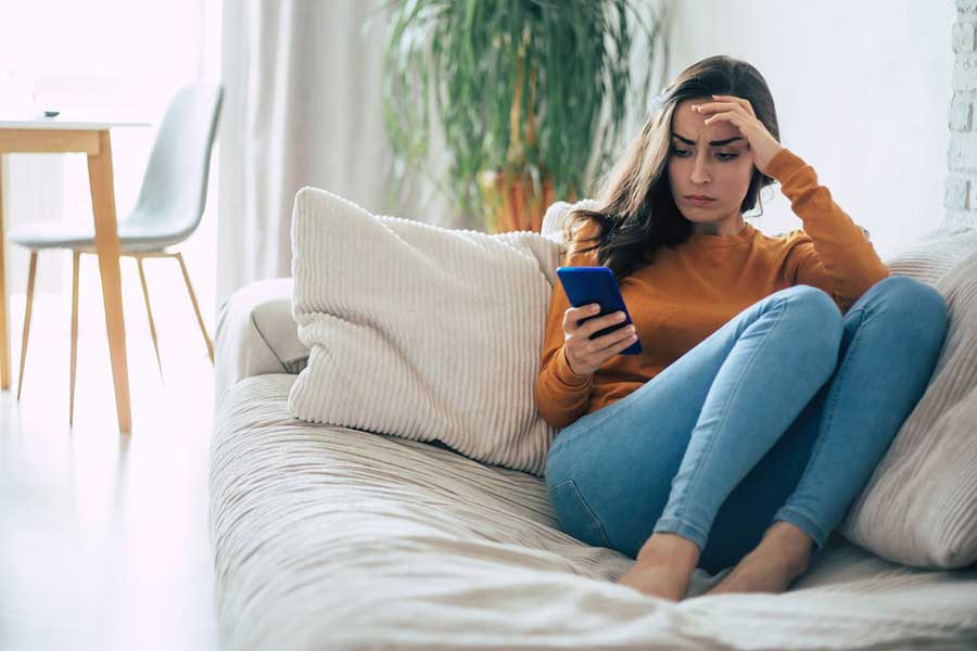 worried woman on phone