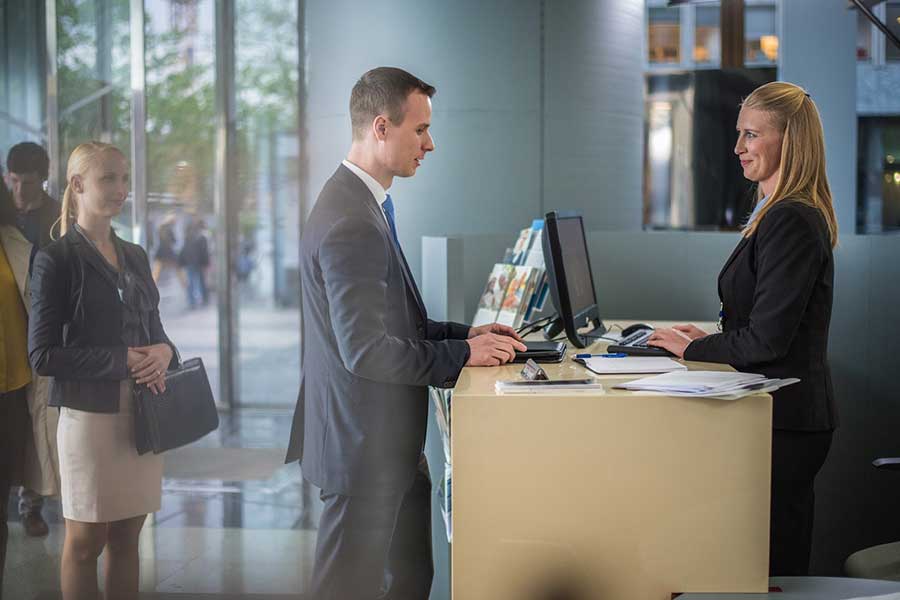 man at bank counter