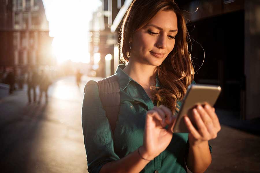 woman checking crypto on phone