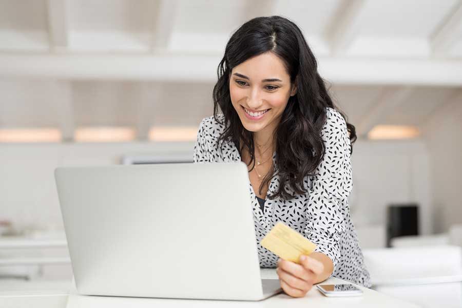 woman holding credit card