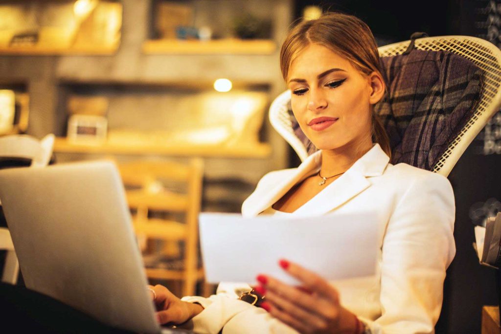 woman paying bills on laptop