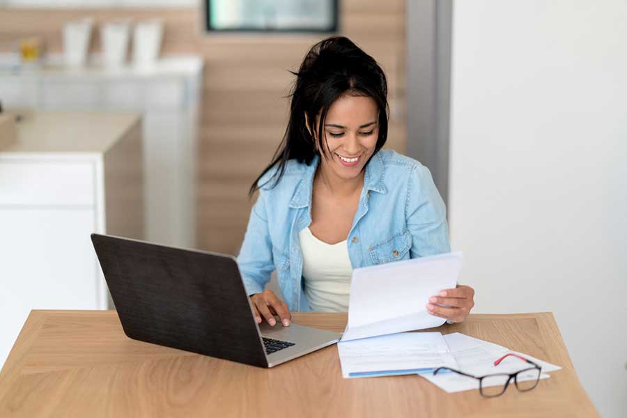 woman paying bills online