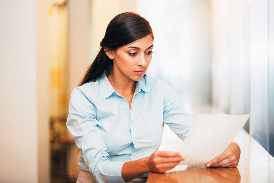 woman reading credit report