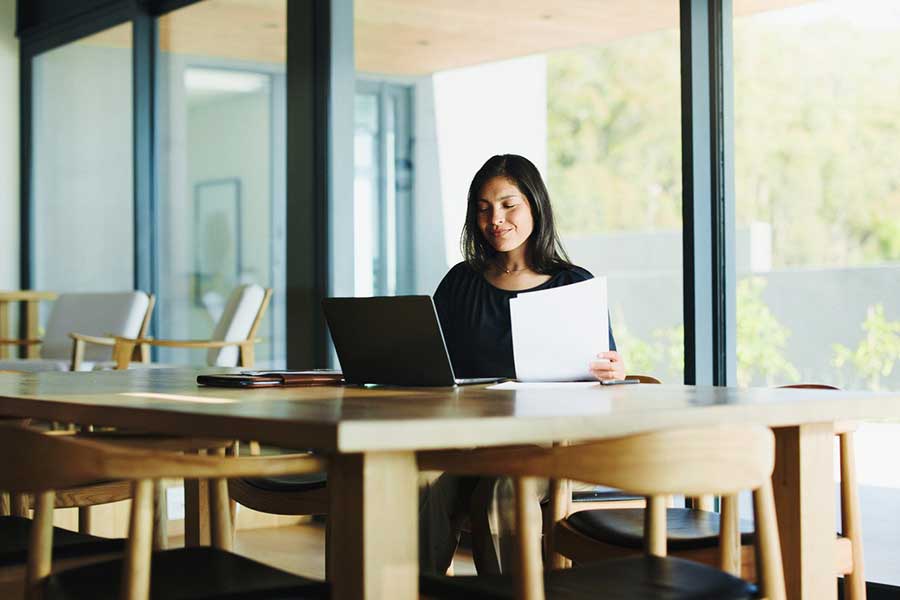woman reviewing credit reports online