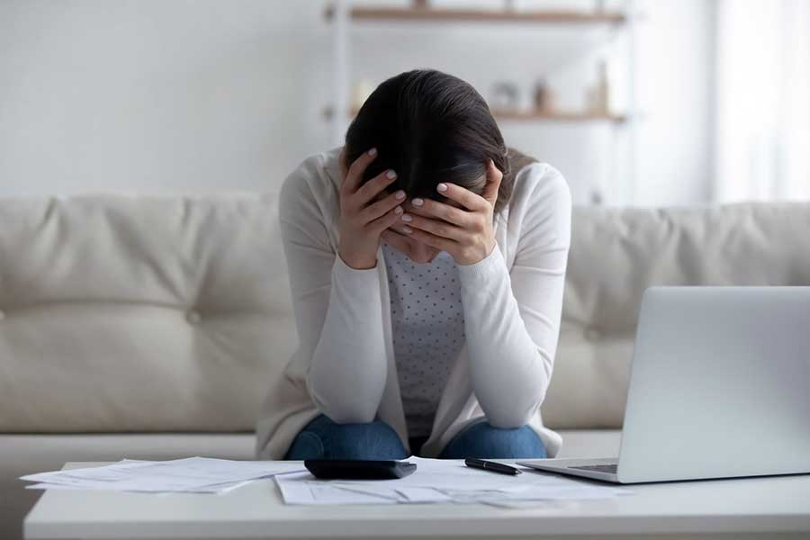 woman stressed about debt