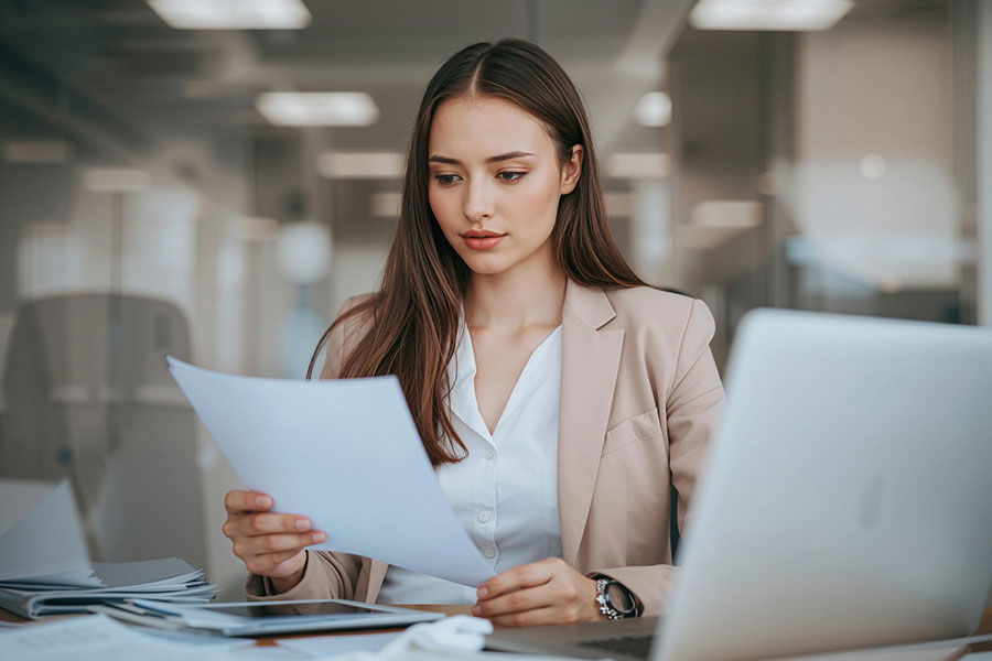 woman reviewing investment documents