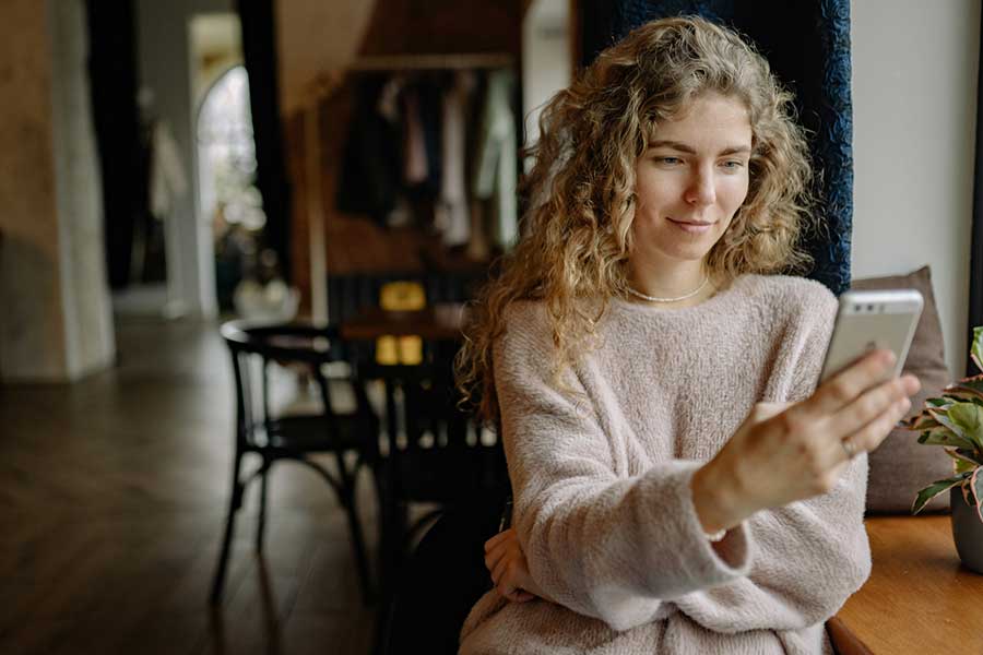 woman using banking app on phone
