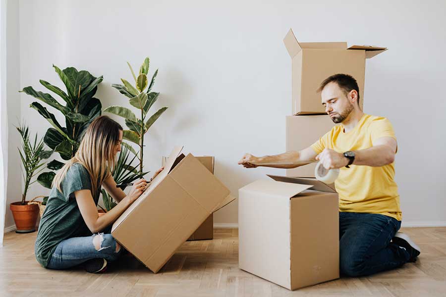 couple moving boxes house