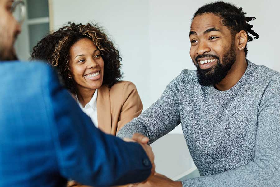 homebuyers at closing table