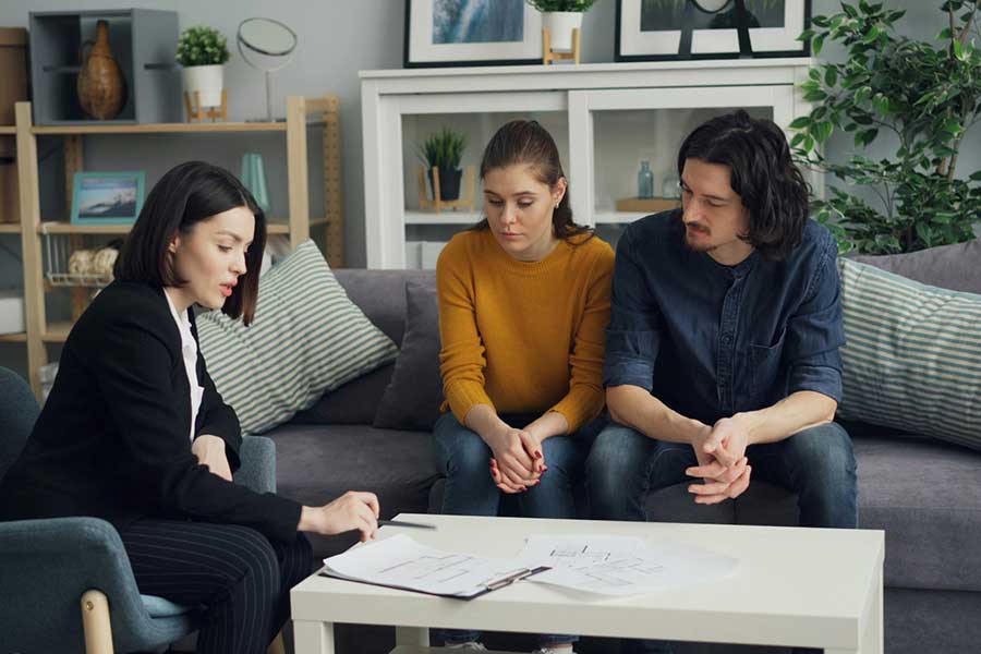 homebuyers meeting with real estate agent