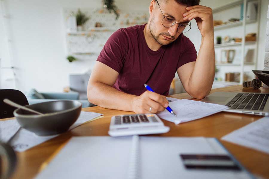 man paying property taxes