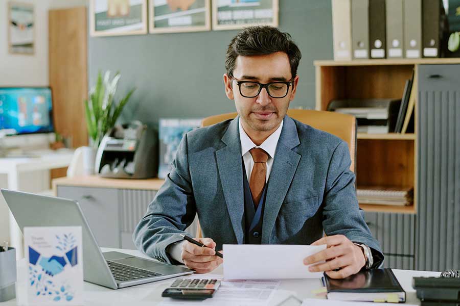 man reviewing tax documents
