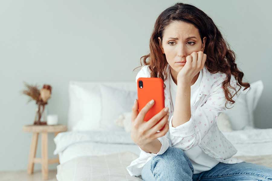 stressed investor looking at phone