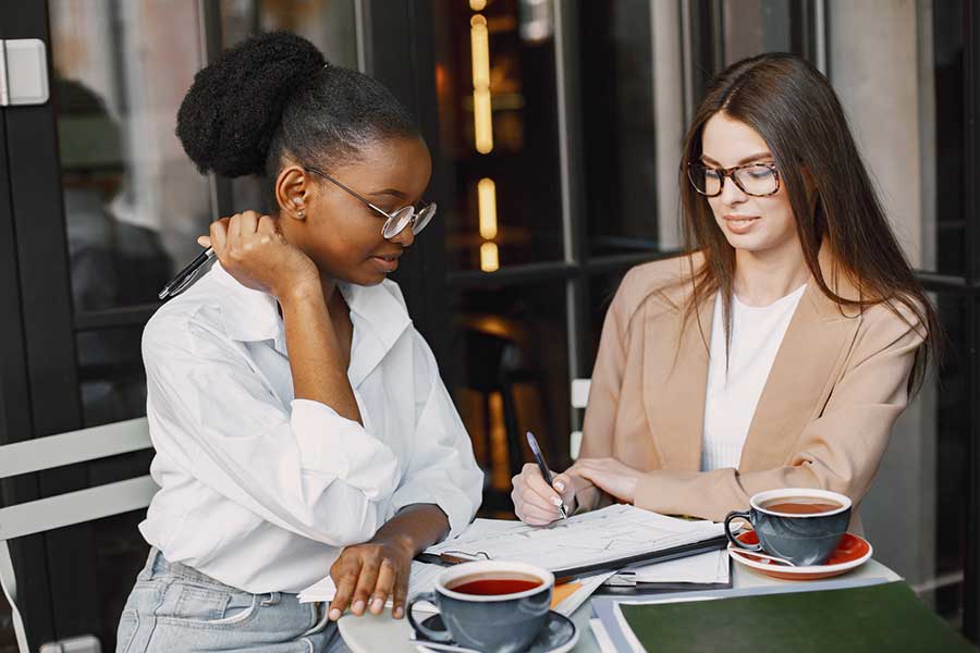 women reviewing tax documents