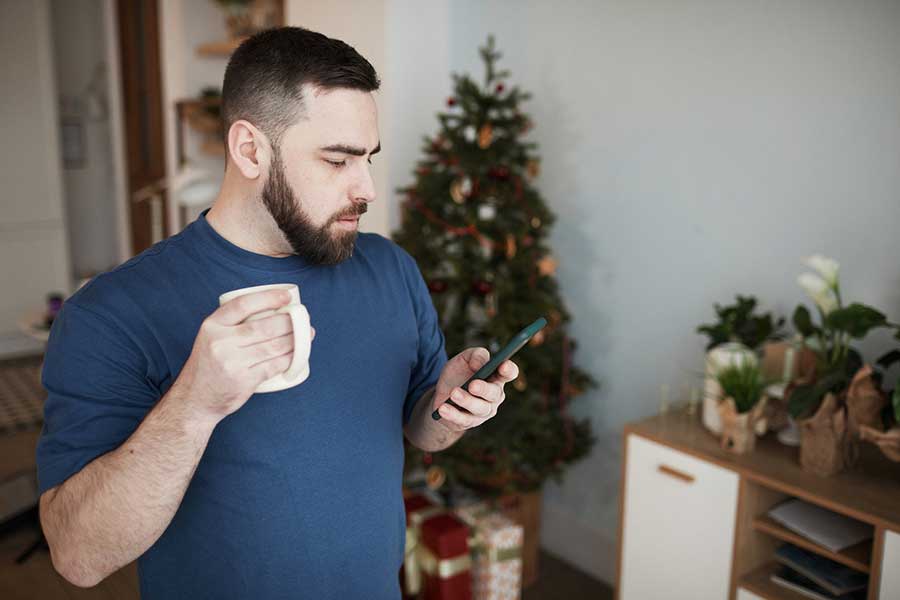 man checking bank account on phone