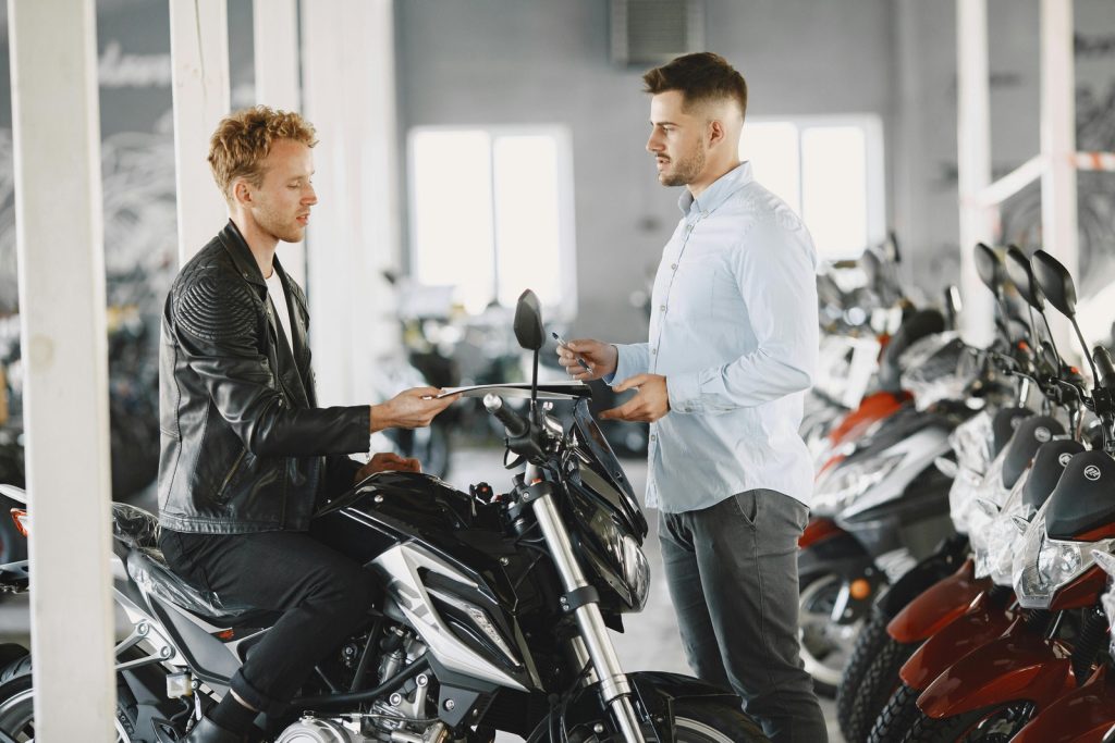 man shopping for motorcycle